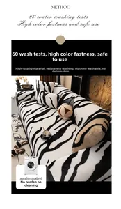 Detail of zebra print plush sofa cover showing durable texture and machine washable fabric