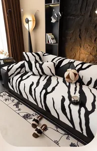 Detail of plush zebra print sofa cover set with fuzzy texture cushions in a cozy living room