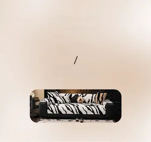 Detail of zebra pattern plush sofa cushion and matching pillow in a modern living room