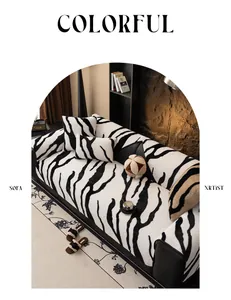 Detail of plush zebra print sofa cover and pillows with thick faux fur texture