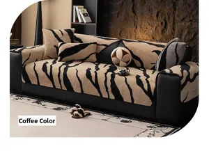 Detail of coffee zebra pattern plush sofa cover with soft faux fur texture and matching pillows