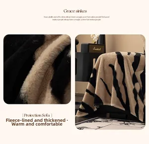 Close-up of zebra pattern plush sofa cover featuring thick faux rabbit fur texture