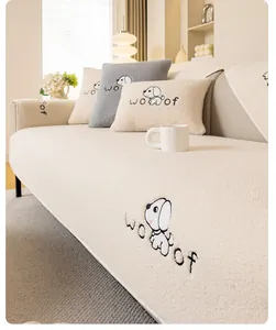 Detail of plush lamb wool sofa cover with cute cartoon puppy embroidery and Woof text