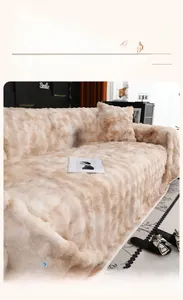 Detail of cream plush sofa cover featuring wavy tufted faux rabbit fur texture