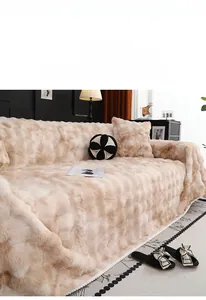 Detailed view of the soft faux rabbit fur texture on a warm beige plush sofa cover