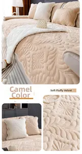 Detail of camel plush velvet sofa cover with embossed floral quilted texture