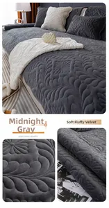 Detail of plush dark grey crystal velvet sofa cushion with floral quilted texture