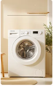 Close-up of a white front-load washing machine with control knobs and LED display panel