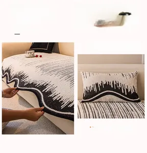 Detailed view of thick knitted fabric texture with irregular wave embroidery on sofa cover
