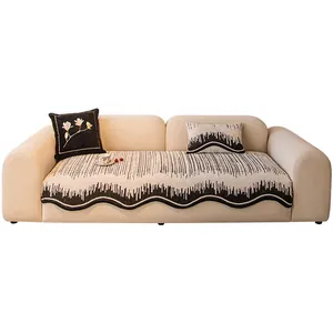 Art Deco style black and white striped sofa cushion with matching floral embroidered pillows