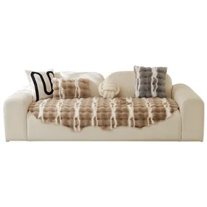 Plush faux rabbit fur sofa cover and decorative pillows in cream and brown tones