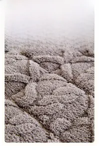 Close-up of premium checkered waffle fabric in coffee grey plush velvet material
