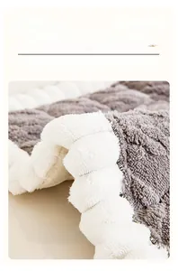 Detailed close-up of thick grey plush sofa cover with soft white faux fur edges