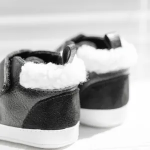Detail of warm winter baby shoes with thick plush lining and premium stitching