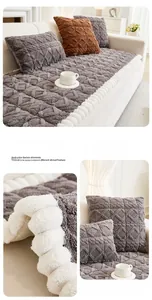 Close-up of dark grey Taff velvet sofa cushion with quilted diamond pattern and pom-pom trim
