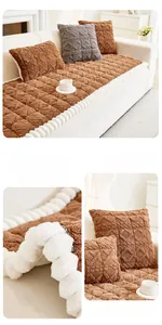 Detail of dark coffee taffeta velvet sofa cover with quilted pattern and plush trim