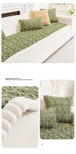 Detailed view of green tufted plush sofa cushion with geometric diamond pattern and trim