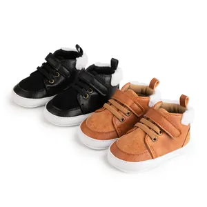 Detail of warm baby winter shoes with double hook-and-loop straps and soft white soles