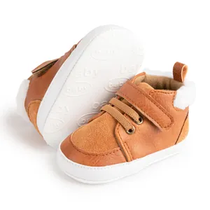 Detail view of brown baby winter boots with warm plush lining and anti-slip baby sole