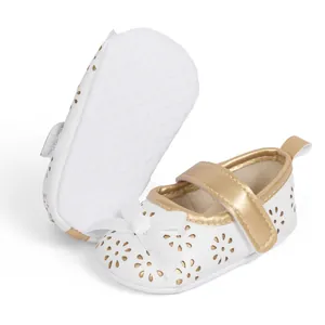 Detail of baby princess shoes with laser-cut flower patterns and non-slip soft soles