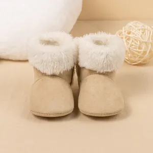 Close-up of warm khaki baby boots with plush white fur lining and soft anti-slip soles