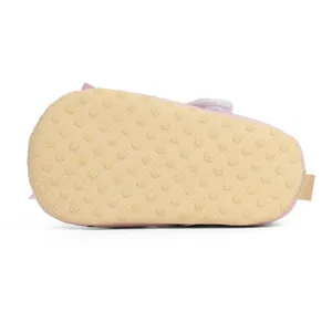 Detail of baby girl shoes with non-slip dot patterned soft sole for walking