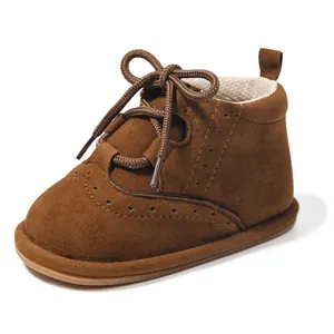 Classic dark brown PU leather baby boots with brogue carvings and non-slip soft soles