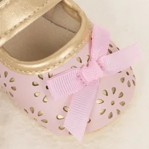 Pink floral laser-cut baby princess shoes with gold trim and ribbon bow detail