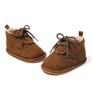 Classic dark camel PU leather baby boots with non-slip laces and brogue wingtip details