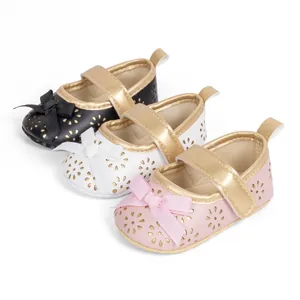 Floral cutout baby Mary Jane shoes with bow in black, white, and pink leather colors