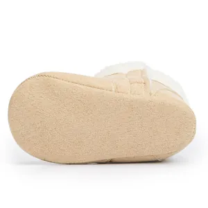 Detail of khaki baby boots showing the soft fabric sole and warm plush lining texture