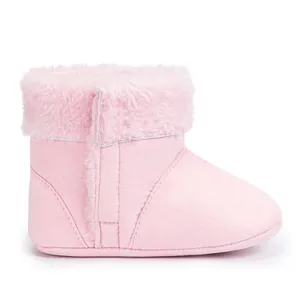 Detail view of pink baby winter boots with faux suede material and plush faux fur trim