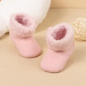 Pink fleece-lined baby snow boots with soft soles and warm faux fur for winter