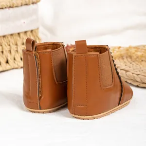 Detail of brown baby Chelsea boots with elastic sides and non-slip rubber soles