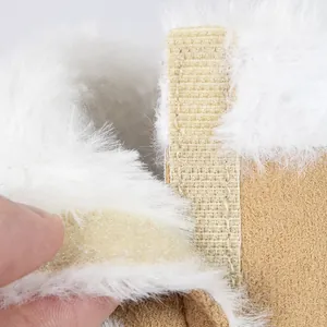 Detail of warm faux fur lining and velcro closure on khaki suede baby boots