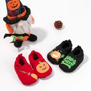 Detail of Halloween baby soft sole shoes with pumpkin prints and elastic cuffs
