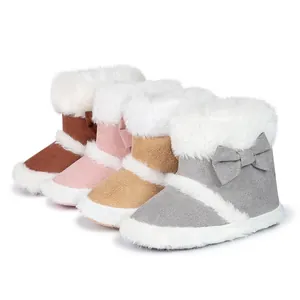 Detail view of winter baby boots with soft faux fur lining and cute bow accents