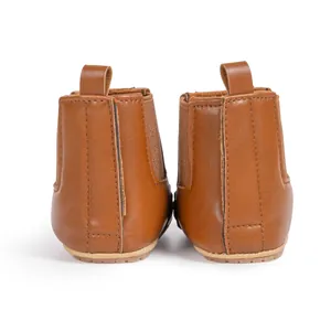 Rear view of brown leather baby Chelsea boots featuring elastic side panels and heel pull tabs