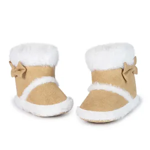 Detailed view of warm baby snow boots with fuzzy fur trim and cute side bow knots