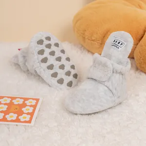 Soft light gray plush baby shoes with anti-slip heart-patterned soles for winter warmth