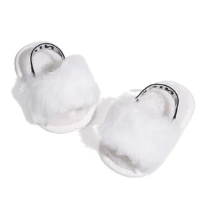 Detail view of white plush baby slippers with fuzzy texture and NICE elastic heel strap