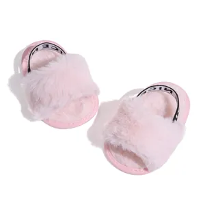 Detail view of pink plush baby slippers with soft faux fur and elastic NICE heel strap