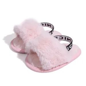 Detail of pink faux fur baby slippers with soft soles and elasticated NICE heel straps