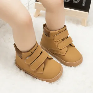 Detail of toddler leather walking shoes in brown with secure double hook and loop straps