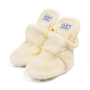Detail of baby warm walking shoes with soft terry cloth and adjustable velcro strap