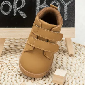 Close-up of camel brown PU leather toddler sneakers with dual hook-and-loop straps