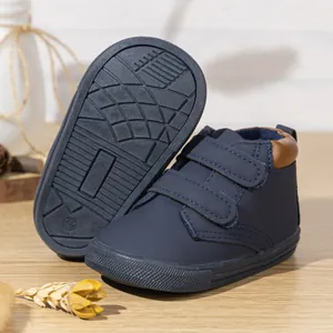 Detailed view of navy blue toddler shoes with double velcro and non-slip soles