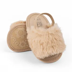 Fuzzy apricot infant slippers with elastic backstrap and non-slip sole for 0-6 months