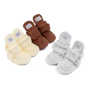 Soft fleece baby walking shoes with adjustable velcro straps in three neutral colors