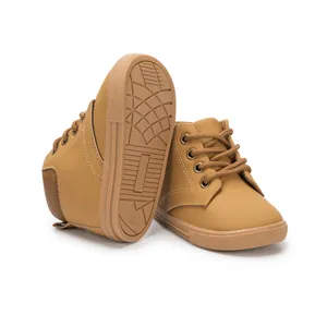 Detailed view of brown PU leather toddler boots with non-slip rubber sole and size marking